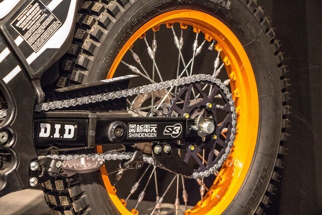 A bike's orange rear wheel